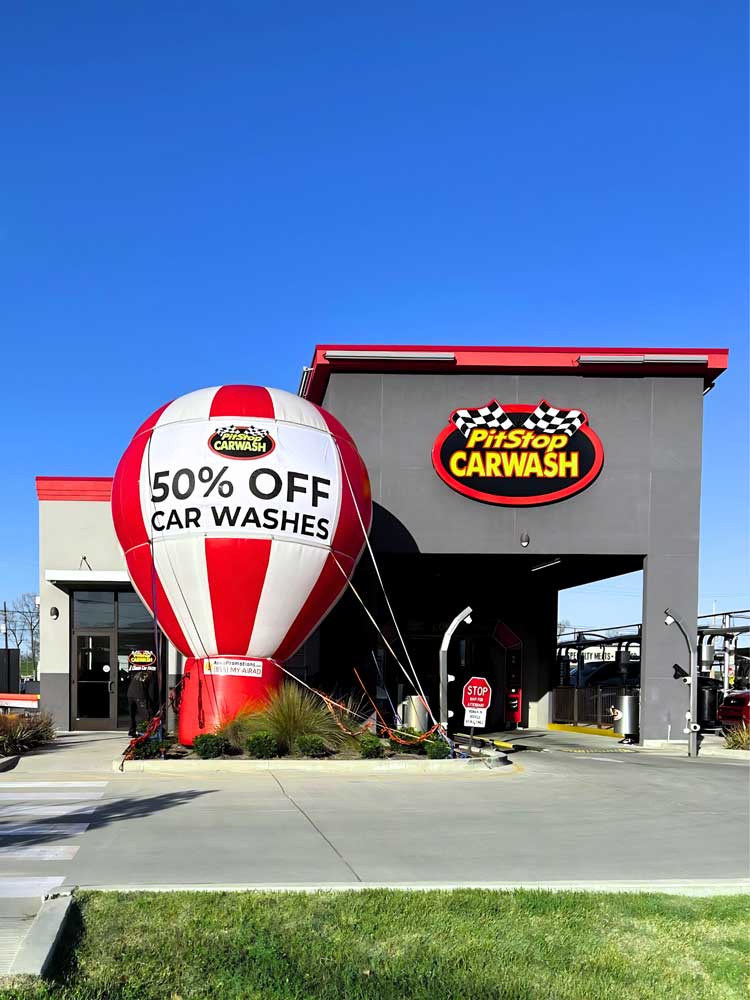 promotional balloon in front of car wash